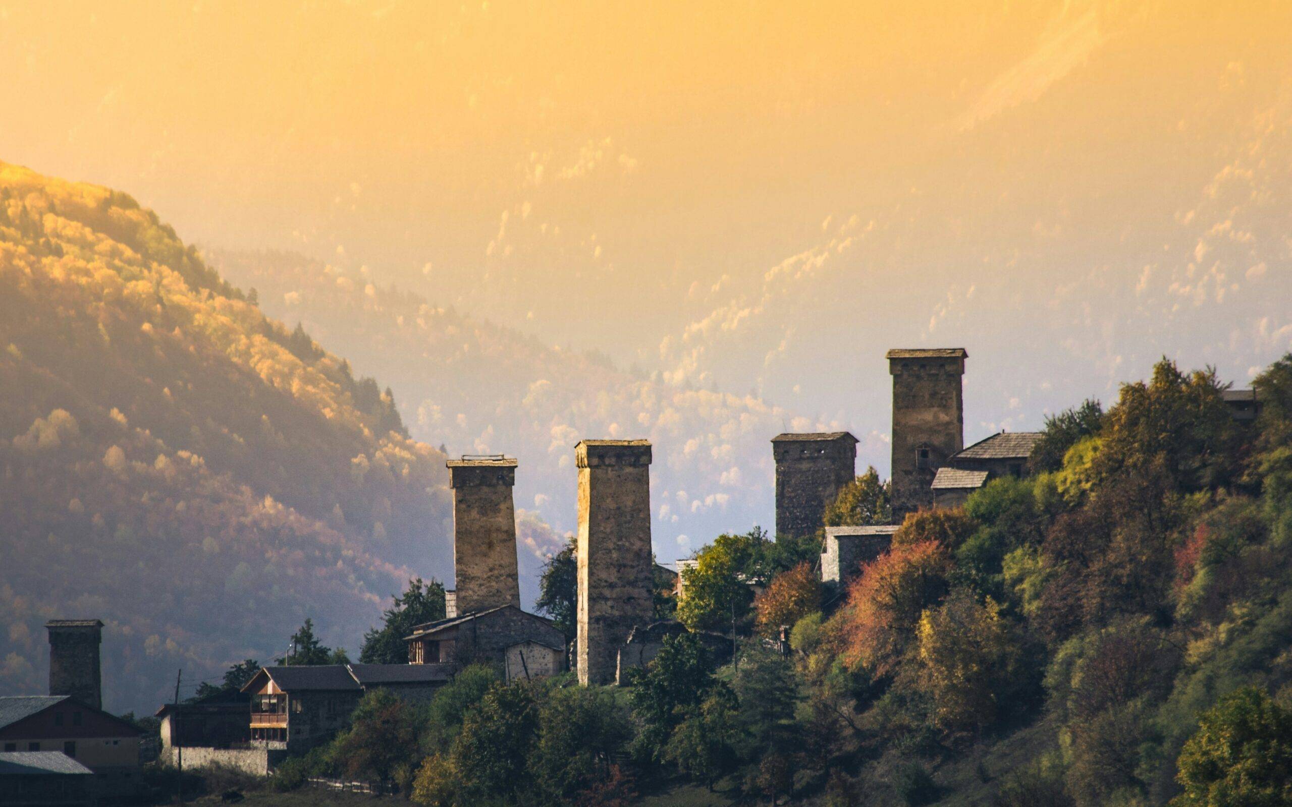 Man standing in mountains near Svan tower